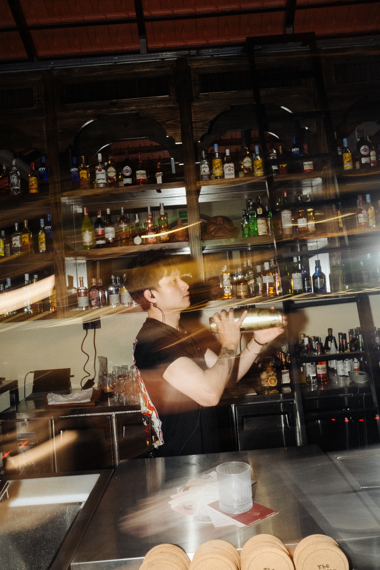 Bartender preparing cocktails at Muối Mè Cocktail Bar