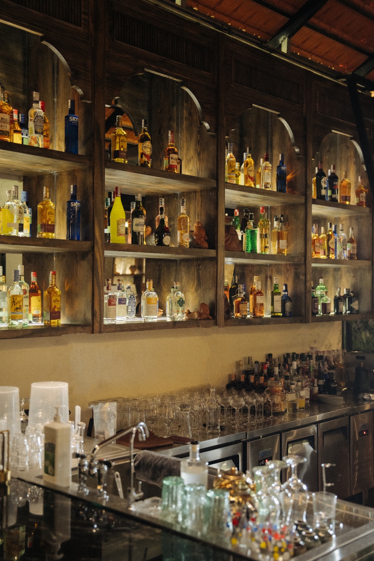 Back bar shelves at Muối Mè Cocktail Bar
