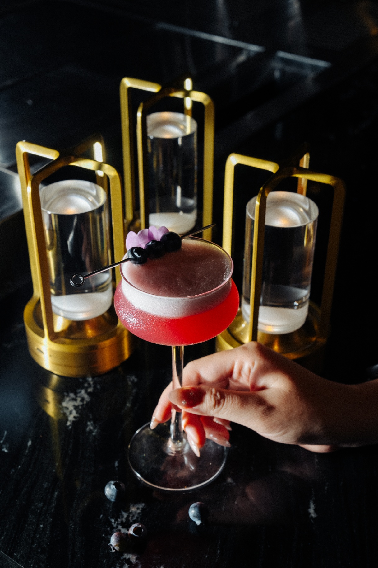 Signature red cocktail at Muối Mè Cocktail Bar